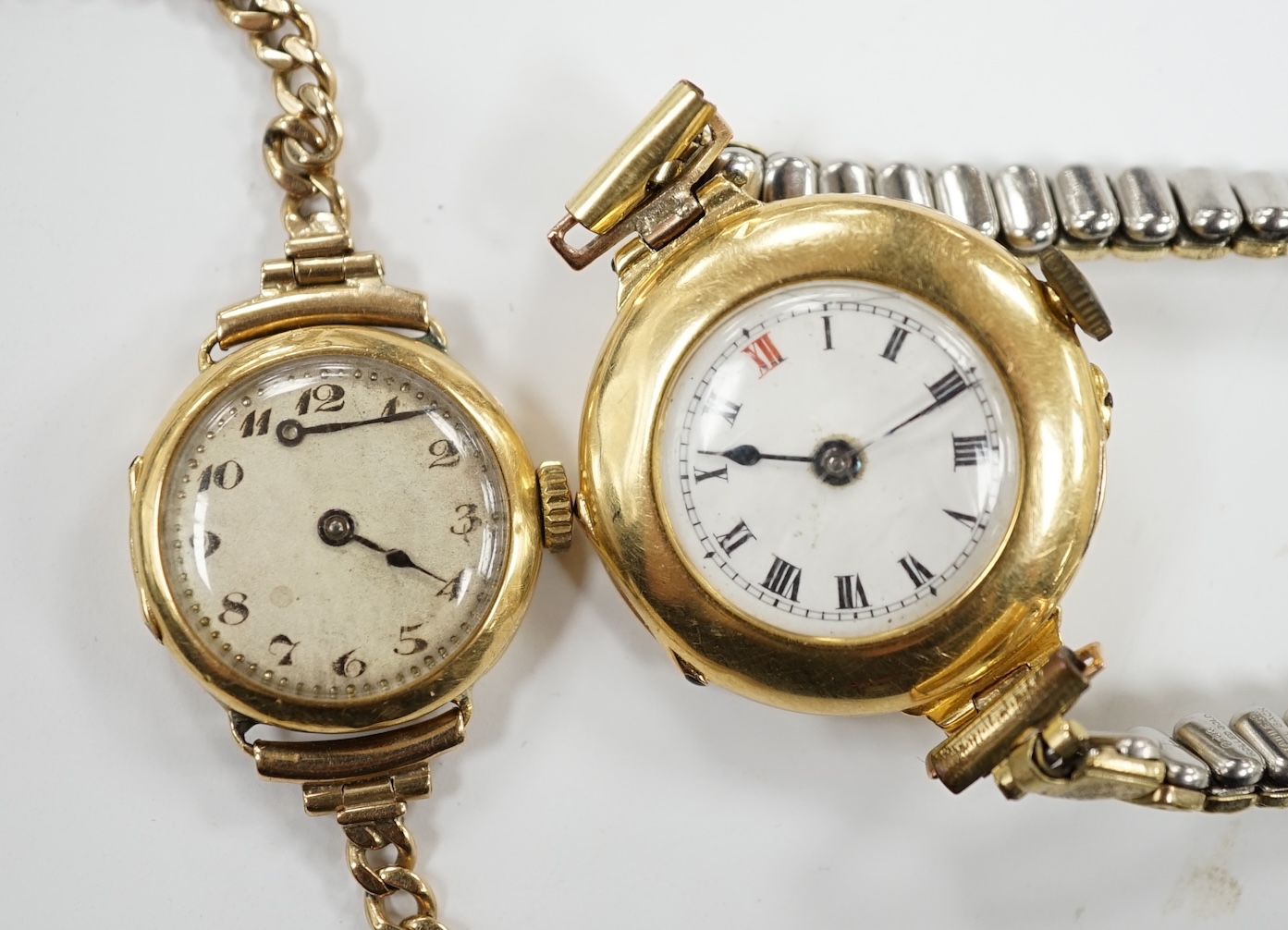 A lady's early to mid 20th century 18ct gold manual wind wrist watch on a 9ct bracelet, together with one other similar 18ct gold manual wrist watch, on a flexible gold plated flexible bracelet.